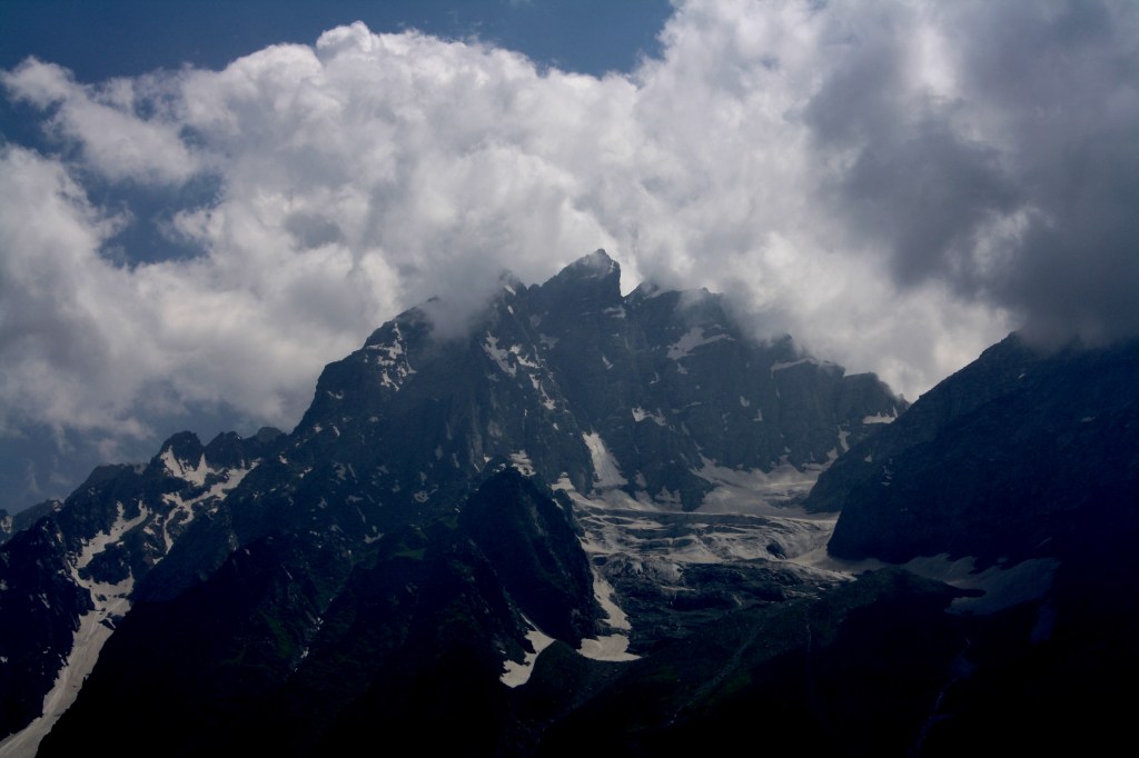 It was an exhilarating experience to be in close proximity to Himalayas. I have a great fascination for these huge mountains  and long pine trees.   This trip was made much prior to abrogation of Article 370.

Post a short trip to Mata Vaishnodevi temple, we proceeded to Pahalgam. Pahalgam is in Kashmir valley and one has to cross the 3 km tunnel to enter into Kashmir from Jammu. Pahalgam is 96 km away from Srinagar at height of 2195 mtrs in "Liddar Valley". Place is cool and known for its natural beauty. It is surrounded by high peaks of mountains and the place we stayed in "Mount View" has good view of the Liddar river and the mountains in front.

From Pahalgam it is worth a trip to Chandanwari (resting point for Amarnath Yatris) and Aru (proununced as "Addo"). One can take a pony ride to Kashmir Valley, Baisaran and Banyahal. We were at Pahalgam for 2 nights. One could hear the chopper taking Amarnath Yatris to Panchtarni from morning till afternoon.

After enjoying Pahalgam, we drove down to Sonmarg which is at a height of 2667 mtrs on Srinagar-Leh Road. Indus River flows close by and the hotel we stayed in had a good view of the Thajawas Glacier. On our way, we got to see ruins of Awantipur. The archaeologists believe that 2 temples dedicated to Lord Vishnu and Shiva was built in 9th Century by King Avantivarman.

Hotel Sonmarg Glacier had all the comforts and good dining. On reaching, we immediately went to enjoy the beauty of the Glaciers. Since next day was our day for Amarnath Yatra, both of us wanted to retire early to ensure we were up at 3 AM to get ready for the trip. 5th of Aug was last day of the Yatra and the most auspicious day (full moon day)

Early morning, we made our way to Baltal from where we were supposed to take chopper to Panchtarni. We were keeping our fingers crossed on the weather. Our Army friend had made arrangements with the pilot of chopper to take us on the 1st flight.

I had the privilege to be on the chopper by the pilot seat who was an ex-army colonel. I was excited as a kid to be viewing the valley at close quarters from the chopper as it made its way to Panchtarni. One could view the Amarnath Yatra route from the top and it definitely did not look an easy one. In less than 5 mns we landed at Panchtarni.

Since temple was closing at 12 in the noon, we had to take a Palki to reach on time. The view of the mountains is heavenly which can only be experienced by one and no amount of words would help to describe its beauty. Amarnath Cave is 12,758 feet hight and cave itself is 60 feet long and 30 feet wide. Below the cave, Amar Ganga flows where pilgrims take bath before entering the cave. We had a good darshan and felt blessed to have seen the ice lingam from close quarters.

After 2 nights at Sonmarg, we made our way to Srinagar where we were supposed to stay in Houseboat "Canberra" for 2 nights. The moment we arrived at Srinagar, there was some tension on the outskirts and we had to go via by-lanes to Dal Lake. The houseboat was beautiful and looked almost like a palace inside with exquisitely carved furniture.

Unfortunately, we did not find our houseboat Manager very homely and he seemed to ignore aspects of good hospitality. He and his wife never bothered to find out if we wanted lunch or dinner. We decided to have our dinner at Shamiana restaurant on Dal Lake road instead of having to remind the Manager every time.

While taking a Shikara ride in the evening, the cloud started gathering and in less than half an hour, we were welcomed with strong winds and rain. Luckily our one hour Shikara ride came to an end before getting caught in the downpour. We had yummy Afghani Chicken at Shamiana and around 9:30 PM decided to go back to our houseboat. More surprises were awaiting us as there was no power and the Manager informed that he will switch off the generator by 10:30PM which meant no fans for us !

It seemed that he was more interested in saving money than treating guests well. We decided to leave for Gulmarg the next day itself as we were not enjoying our stay at houseboat. Come morning, we left the place before 9 AM. While in Srinagar, we visited Shankaracharya temple, Mughal Gardens, Chasma Shahi, Lal Chowk, old Srinagar town etc.

In the old town, we could see a pakistani flag hoisted on top of a building ! It was a surprise to hear a chef informing us that Dr. Manmohan Singh from India visited them recently !! We asked him innocently if he was part of India or Pakistan to which he informed that youngsters do not want to be part of India or Pakistan but are looking forward to a Azad Kashmir which will be a separate country. The Army feels that most of their powers have been taken away by Government and they have to turn a blind eye to certain disturbing events in the state. If only they were given power, they can turn things around within months.

We were too happy to leave Srinagar and reach Gulmarg which is also known as "Valley of Flowers" situated at a height of 2730 mts. We stayed at Heevan Retreat which is nicely placed and very close to the Gondola (cable car). Since this was our last place to relax, both me and my friend decided to take it easy and enjoy the pristine beauty. The next day we took the Gondola to Khilanmarg and the Alpathar range from where one could see the LOC. We also freaked out on the sledge.

While in Kashmir one should definitely not miss Kashmiri Wazawan. We tried out Rista (Lamb meat balls), Mutton Roganjosh, mirchi Korma but missed savouring the Gustaba. One can also enjoy Kashmir tea "Kahwa" which has "Kesar" and dry fruit pieces in it. They do not use tea leaves.

